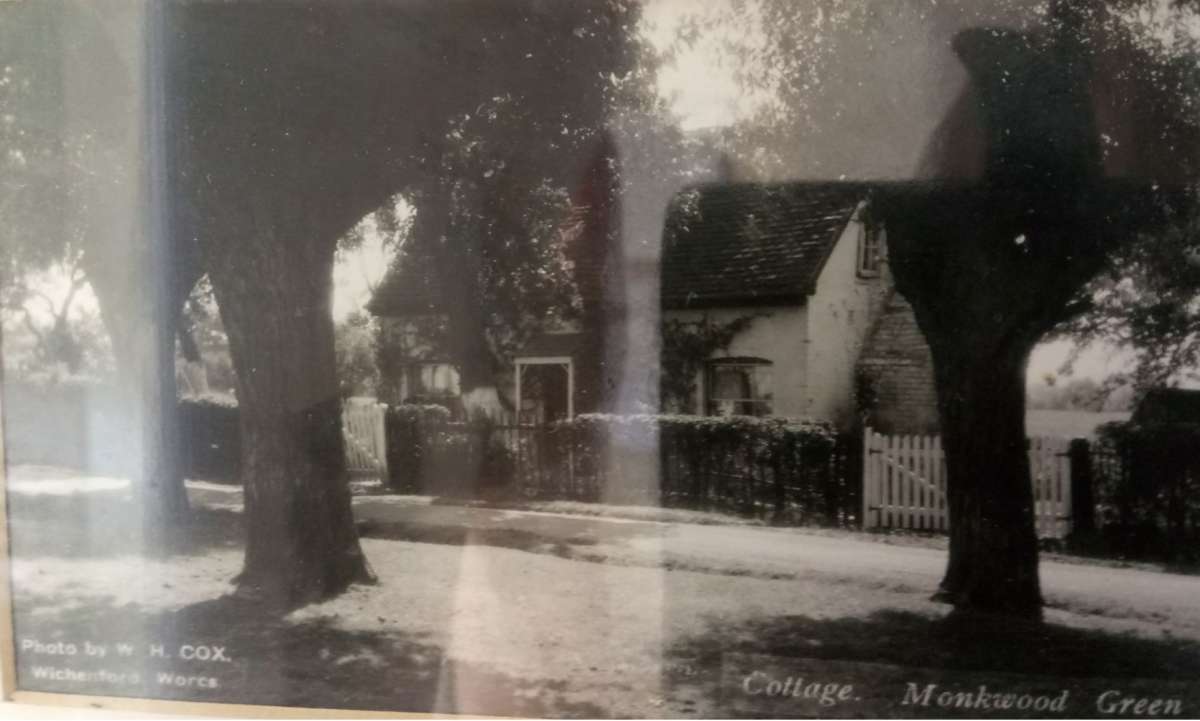 Black and white photo of a cottage on Monkwood Green